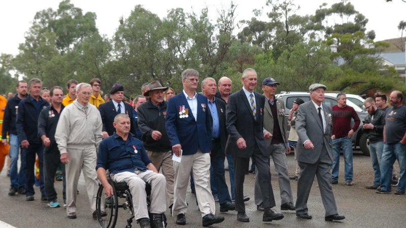 Eudunda RSL members and volunteers services march past the applauding crowd