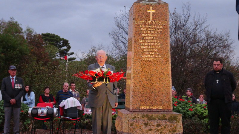 Mike Colbey President Robertstown RSL lays a wreath on behalf of thier Club