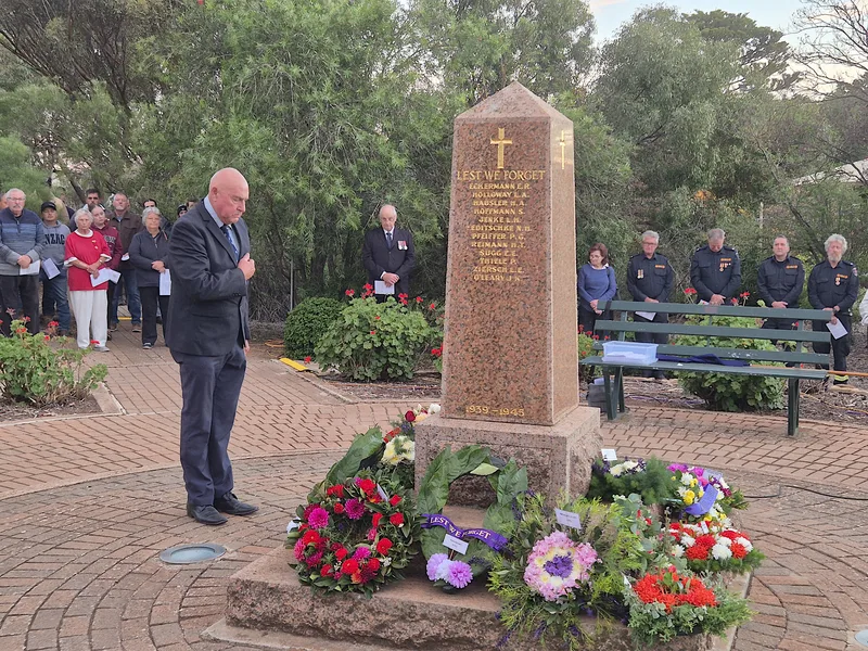 Andrew Partington pauses after he laid a wreath on behalf of the Merchant Navy Association of South Australia in memory of 'Those who were lost at sea and have no known grave'.