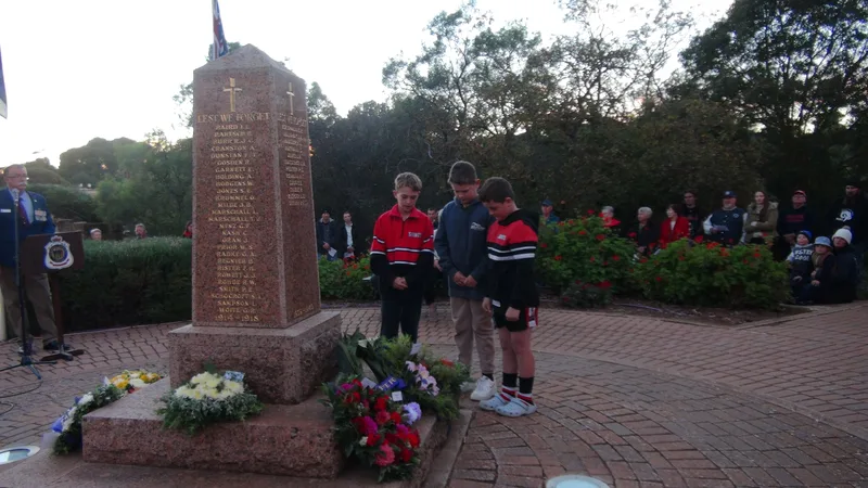 Saints Football Boys Laying Wreath